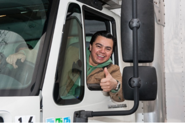 a moving truck driver giving a thumbs up